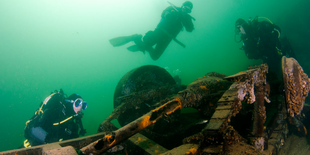 Under water wreck image with scuba divers