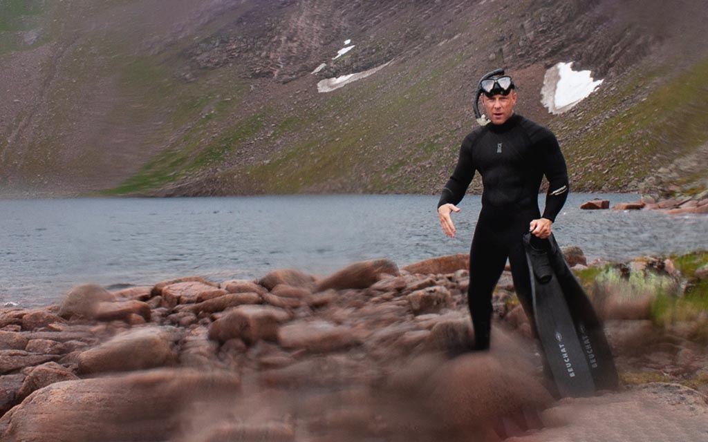 Andy Torbet standing at the shores of Loch Coirre an Lochan