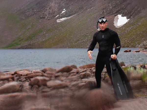 Andy Torbet standing at the shores of Loch Coirre an Lochan