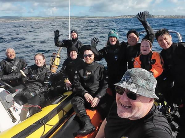 The team on the boats after a successful dive