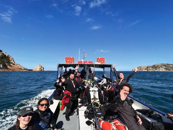 SUSAC members on the blue ocean heading to the dive spot