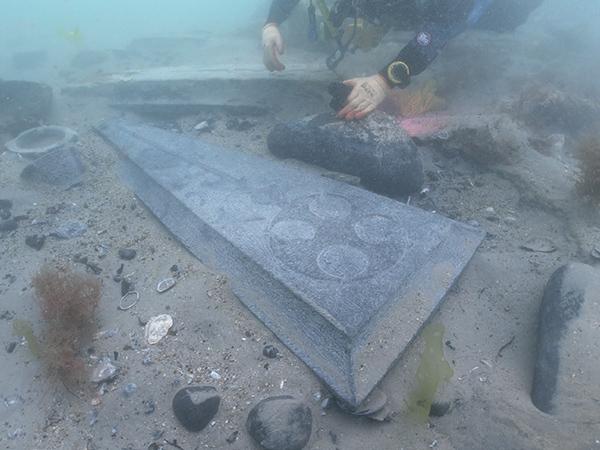 Purbeck stone gravestones on the Mortar Wreck - (c) Bournemouth University