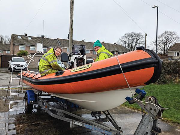 Thumbnail photo for Volunteers pitch in for club boat repairs