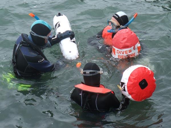 Snorkel instructor in sheltered water teaching