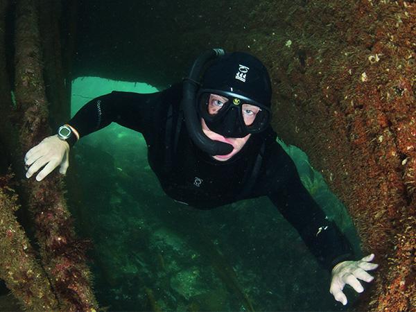 Andy finds a safe swim-through on a shallow shipwreck.