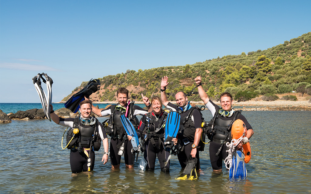 group of scuba divers learning overseas