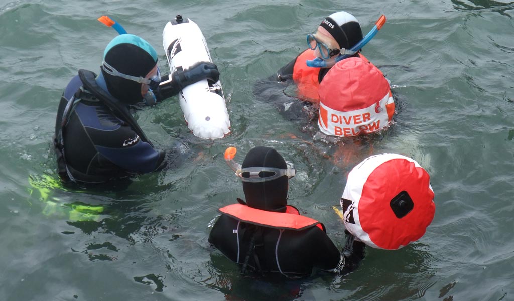 Snorkel instructor in sheltered water teaching