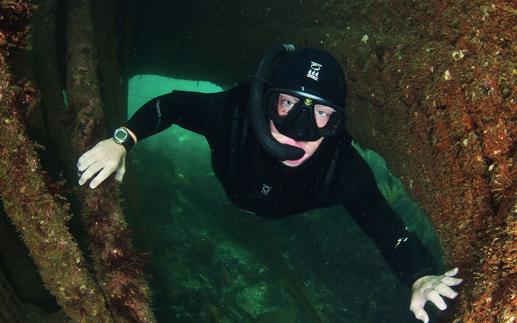 Andy finds a safe swim-through on a shallow shipwreck.