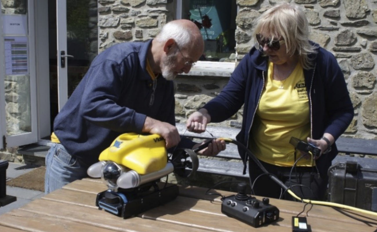 Two volunteers get to grips with an ROV