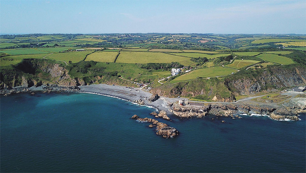 An aerial view of Porthkerris Cove and Drawna Rocks