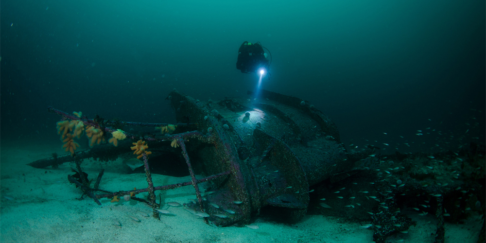 Diver approaching wreck in Shetland