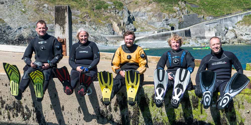 A group of divers topside in kit 