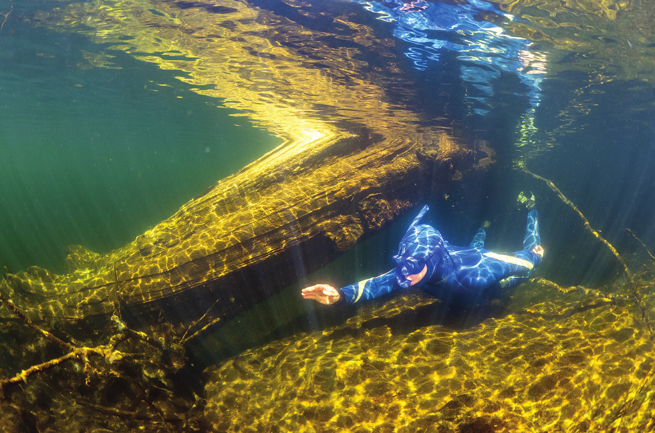 Andy Torbet snorkelling in a shallow body of water