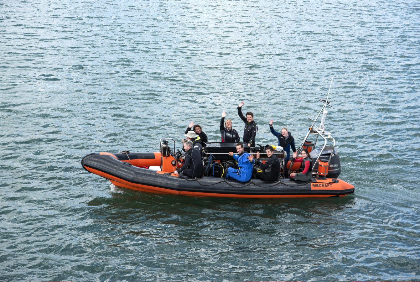 Divers underway on a RIB to a dive site