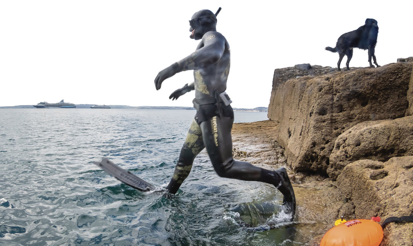 Andy Torbet enters the water in snorkelling gear